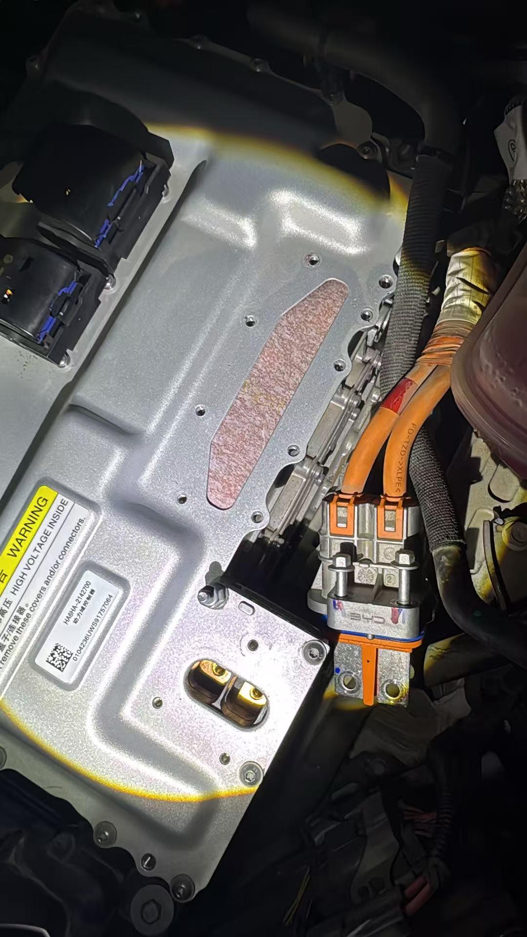 BYD Seal 05 Power Domain Controller with high-voltage warning label, mounted in engine bay